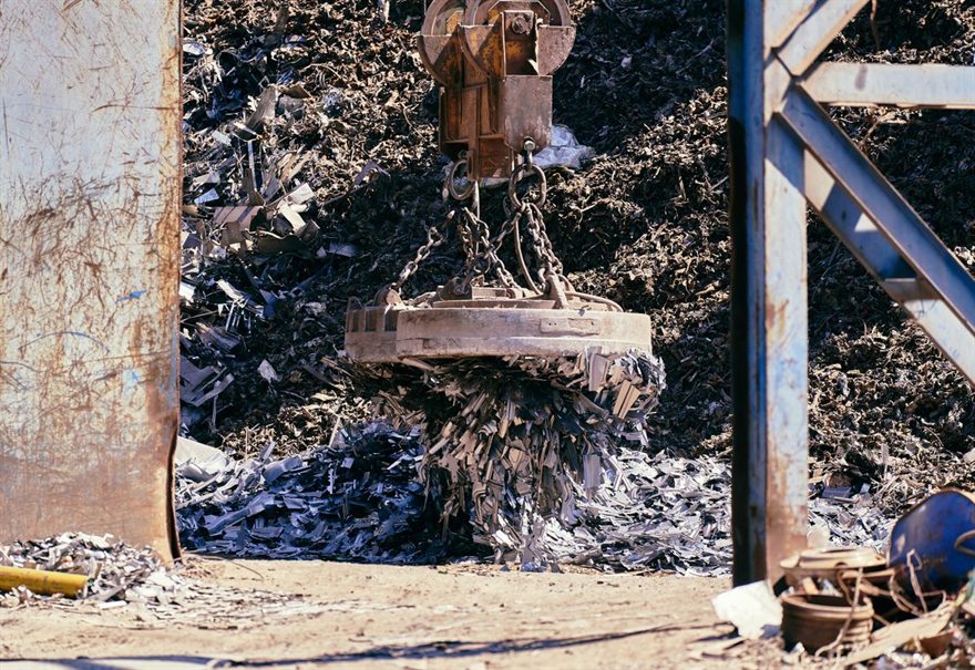Lifting magnet sorting scrap metal for material recovery