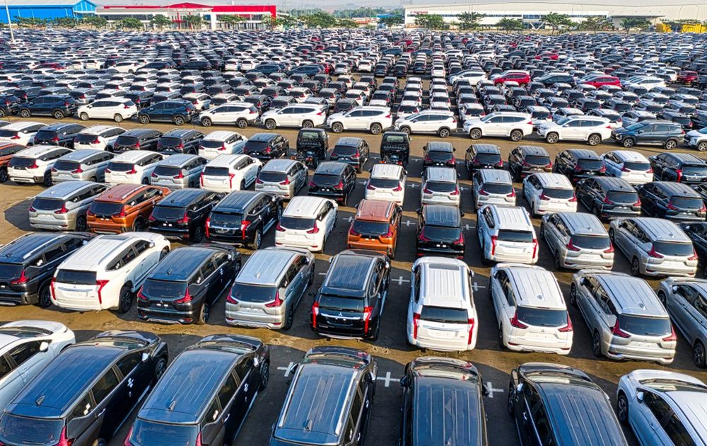 Finished passenger vehicles staged at an OEM despatch yard